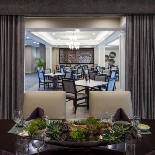 A modern and elegant dining area with stylish decor and seating arrangement.
