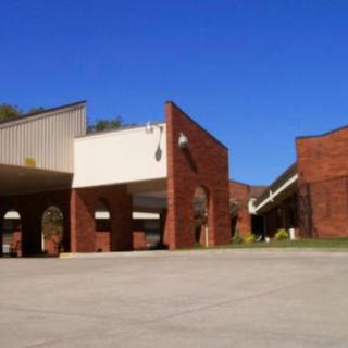 A view of a modern architectural structure against a clear blue sky.