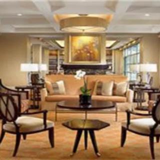 A beautifully decorated living room with elegant furniture and warm lighting.