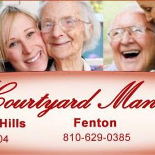 Happy senior citizens in an assisted living environment at Courtyard Manor.