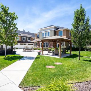 A beautiful backyard with a gazebo on a sunny day.