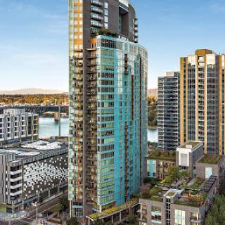 A stunning view of a modern skyscraper amidst the urban landscape.