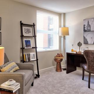 A cozy home office space with a desk, chair, and modern decor.