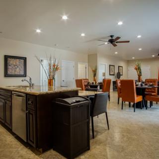 A modern open-concept kitchen and dining area with contemporary furnishings.