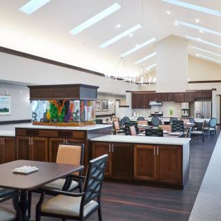 A spacious and modern kitchen and dining area with abundant natural light from skylights.