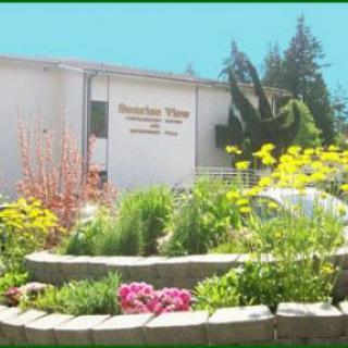 A beautifully landscaped garden in front of a building.