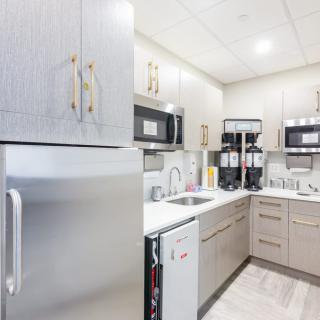 Modern kitchen with sleek appliances and ample storage space.
