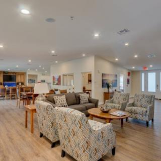 A spacious and inviting living area featuring modern furniture and a cozy ambiance.
