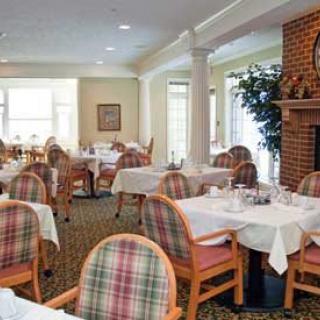 A cozy restaurant dining room with a warm, inviting atmosphere.