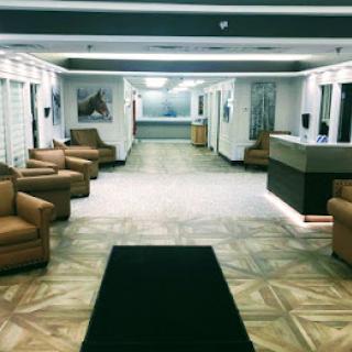 A modern lobby featuring comfortable seating and a reception desk.
