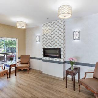 A cozy and inviting living room with stylish furniture and a modern fireplace.