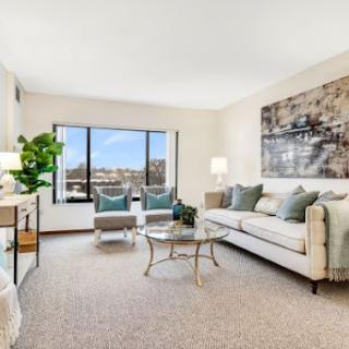 A bright and inviting living room with modern decor and ample natural light.