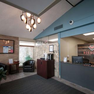 Modern reception area with seating and contemporary decor.
