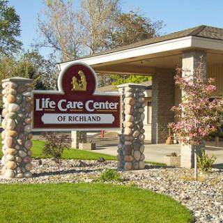 Entrance of the Life Care Center of Rethins, showcasing a welcoming environment for residents.