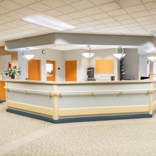 A spacious and well-lit reception area with a front desk.