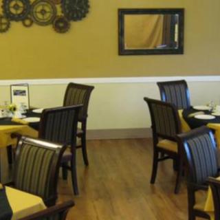 A cozy restaurant dining area with neatly arranged tables and chairs.