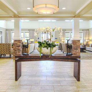 A modern and elegant lobby featuring stylish furniture and decor.