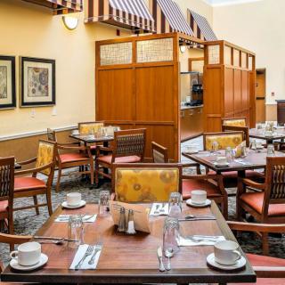 A cozy restaurant dining area with neatly set tables and chairs.