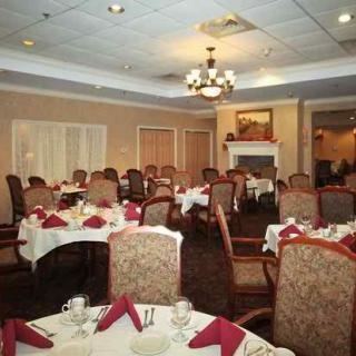 A well-decorated dining area with neatly arranged tables and chairs.