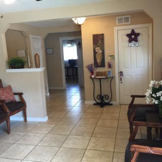 A cozy lobby area with decor and comfortable seating.