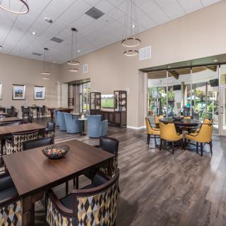 A modern dining area with wooden flooring and stylish furniture.