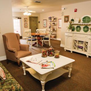 A cozy living room with warm decor and comfortable furniture.
