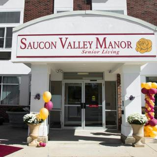 Entrance of Saucon Valley Manor decorated with balloons.