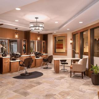 A modern salon interior with stylish furnishings and elegant lighting.