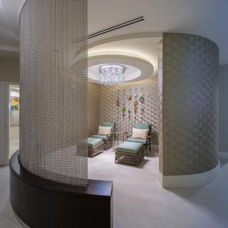 A luxurious spa relaxation area with comfortable lounge chairs and modern decor.
