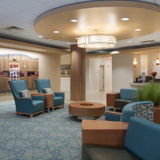 A modern lobby area featuring comfortable seating and stylish lighting.