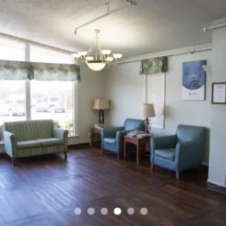 A cozy waiting room with comfortable seating and natural lighting.