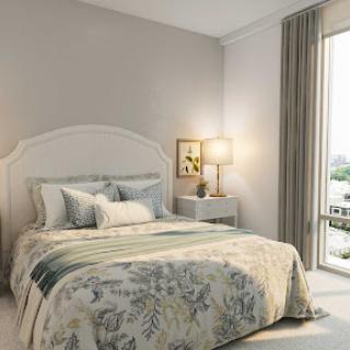 A cozy and elegantly designed bedroom featuring a comfortable bed, soft lighting, and natural light streaming through the window.