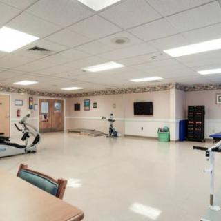 An indoor fitness center with various exercise equipment.
