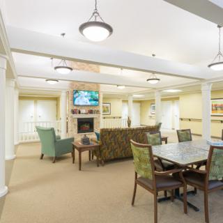 A cozy lounge area featuring comfortable seating, a television, and a welcoming atmosphere.