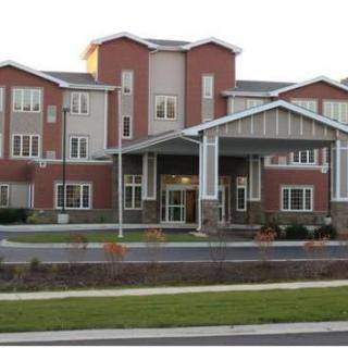 A modern residential apartment building with a brick exterior.