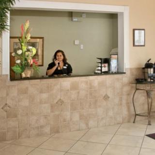 A woman at the hotel reception desk.