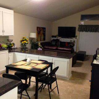An open floor plan home with a cozy kitchen and living area.