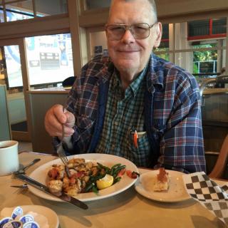 A man enjoying a meal at a restaurant.