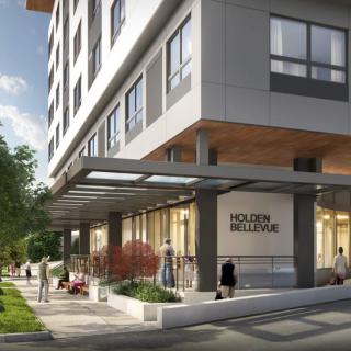 Modern hotel exterior with urban street view.