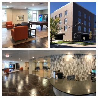 A modern building with well-furnished interiors, featuring a reception area and a lobby.