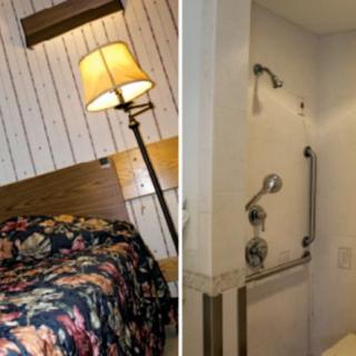 A cozy hotel room with a floral bedspread and an adjacent bathroom featuring a shower.