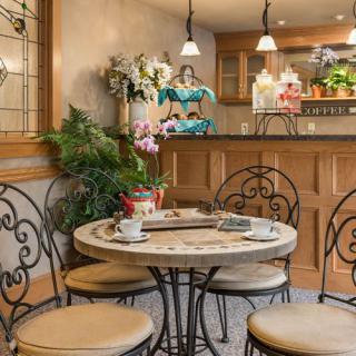 Cozy cafe interior with a round table and decorative elements.