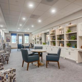 A modern living room featuring comfortable seating and built-in bookshelves.