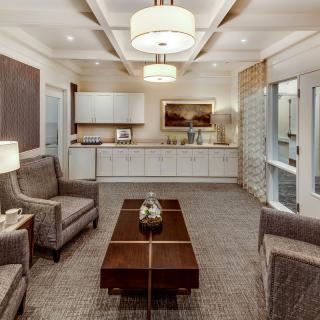 A modern living room with elegant furniture and soft lighting.