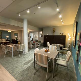 A cozy indoor dining area with neatly arranged tables and chairs.