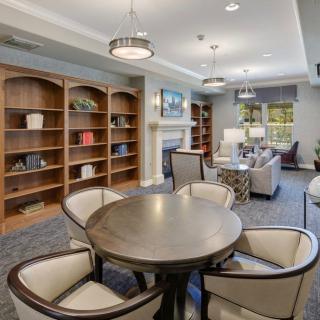A modern library interior with comfortable seating and bookshelves.