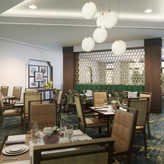 A well-decorated restaurant dining area with neatly arranged tables and ambient lighting.