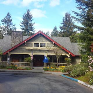 A charming restaurant nestled in a scenic, wooded area.