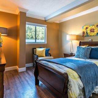 A cozy bedroom with warm lighting and elegant decor.
