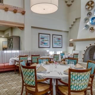 A beautifully set dining area in an elegant restaurant interior.